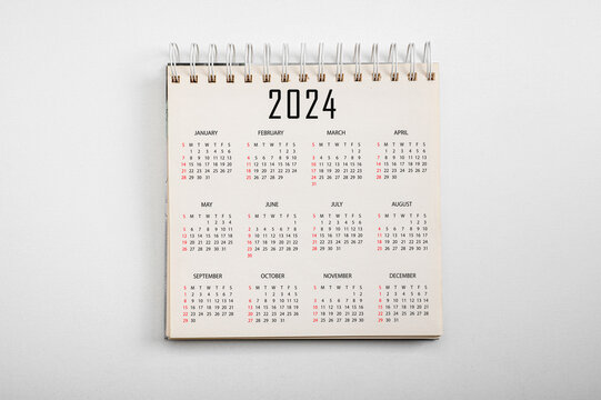 Wall Mural -  - Calendar Year 2024 schedule on paper background. Flat lay with calendar. 12 months desk calendar 2024 Calendar desk 2024 on white background