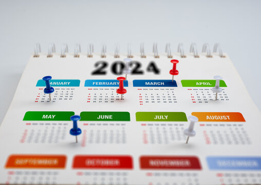 Wall Mural -  - 2024 Calendar planning. colorful pin thumbtack date on calendar or planner. 2024 planning and scheduling or event reminder concept. pins on calendar event