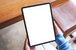 © Farknot Architect - Top view mockup image of a woman holding digital tablet with blank white desktop screen