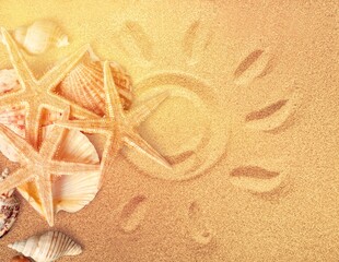 Starfish and seashells on the sand beach at sea