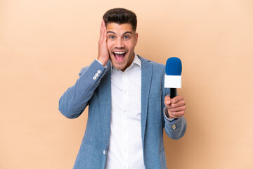 Young caucasian TV presenter man isolated on white background with surprise and shocked facial expression