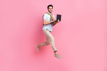 Aufkleber - Full length profile photo of excited person jumping run hold netbook empty space isolated on pink color background
