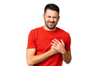 © luismolinero - Young handsome caucasian man over isolated chroma key background having a pain in the heart