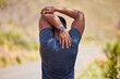 © Ilzer/peopleimages.com - Fitness, man or runner stretching arms for fitness training, wellness or cardio exercise outdoors on road. Relax, flexibility and back view of healthy male athlete in warm up to start running workout