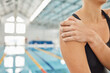 © Ilzer/peopleimages.com - Hands, injury and shoulder pain at swimming pool with woman after training, exercise or accident. Sport, swim or athlete with arm problem, arthritis or fibromyalgia, osteoporosis or medical emergency
