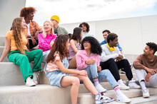 Happy Playful Multiethnic Group Of Young Friends Bonding Outdoors - Multiracial Millennials Students Meeting In The City, Concepts Of Youth, People Lifestyle, Diversity, Teenage And Urban Life
