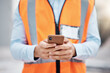 Phone, construction site and search with hands of person for engineering, architecture and communication. Building, social media and mobile app with closeup of contractor for contact and networking