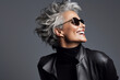 © Denis Yevtekhov - An elegant mature woman laughing heartily, expressing pure happiness Generative AI