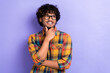 Photo of young indian man casual shirt touch chin genius decision looking empty space intelligence isolated on violet color background