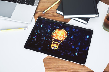 Poster - Creative light bulb with human brain hologram on modern digital tablet display, artificial Intelligence and neural networks concept. Top view. 3D Rendering
