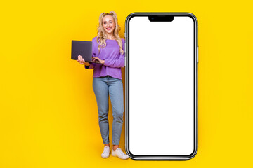 Canvas Print - Full length photo of lovely young lady hold laptop big smartphone placard wear trendy purple garment isolated on yellow color background