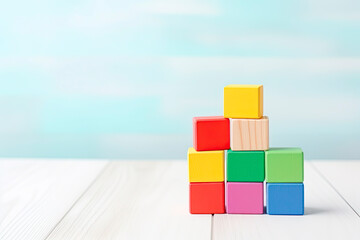 Colorful wooden toy blocks on wooden table in the Children's room.