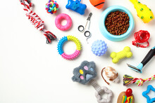 Different Pet Supplies And Toys, Bowl Of Dry Food On White Background. Pet Care, Training, Grooming Concept.