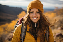Smiling Female Hiker, Adorned In A Cozy Knitted Woolen Hat, Explores The Breathtaking Mountains Of Utah During An Invigorating Autumn Hike, Engaging In Outdoor Activities