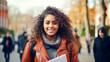© BlazingDesigns - Portrait of a beautiful African American female college student smiling carries papers and notepad and looking at camera with friends on outdoor university background.