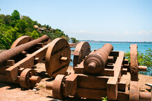Two Old Vintage Cannons On The Candolim Beach At Goa, India. Selective Focus.