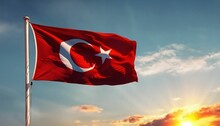 AI Generated Illustration Of The Turkish Flag Fluttering In The Wind, Illuminated By The Sunset