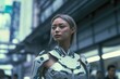 a woman in a futuristic suit stands in the middle of a city