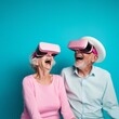 © mimi - Senior couple, smiling and happy, having fun with virtual reality glasses. Old people using new tech trends for headphones glasses sharp pastels alternate reality bright pastels ultra light blue baby