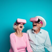 Senior Couple, Smiling And Happy, Having Fun With Virtual Reality Glasses. Old People Using New Tech Trends For Headphones Glasses Sharp Pastels Alternate Reality Bright Pastels Ultra Light Blue Baby 