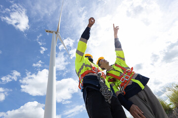 Wind turbine engineer technician male team working service maintenance survey construction site. Eco power energy generator for sustainable people worker.