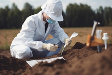 Soil Test. Agronomist Putting Soil With Garden Shovel In Soil Sample Bag Outdoor