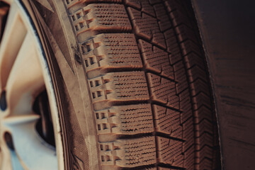 Canvas Print - Dusty car tire after desert ride close-up view