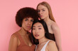 © New Africa - Portrait of beautiful young women on pink background