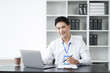 © Parichat - Portrait of young handsome Asian businessman working with laptop computer in the office room.
