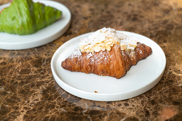 Poster - almonds cream croissant on plate