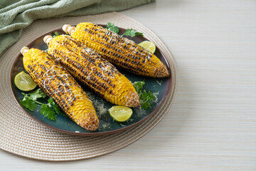 Wall Mural - barbecue and grilled corn with cheese and lime