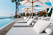 Beautiful luxury swimming pool on sea view and umbrella and chair