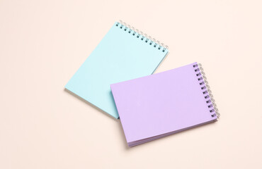 Wall Mural - Two notebooks on beige pastel background. Minimalism. Creative layout