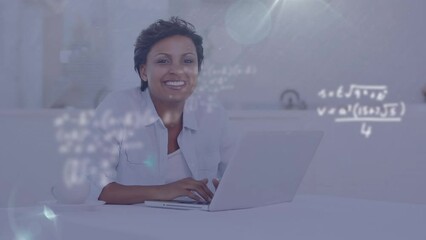 Wall Mural - Animation of mathematical equations and light spot over happy biracial woman using a laptop