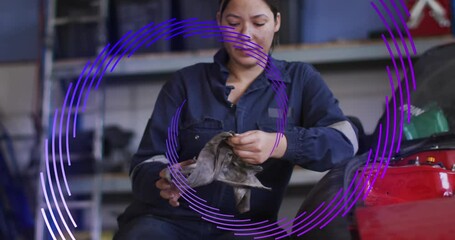 Poster - Animation of purple pattern moving over biracial female mechanic