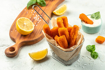 Canvas Print - Fried fish sticks fish fingers with lemon. Restaurant menu, cookbook recipe top view