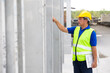 © NVB Stocker - Portrait Asian senior man professional engineering working at precast concrete wall factory. Engineering worker in safety hardhat at factory industrial facilities. Heavy Industry Manufacturing Factory