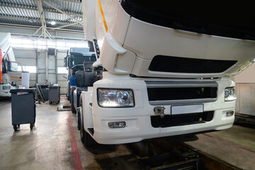 Fototapete - Trucks repair in car service.