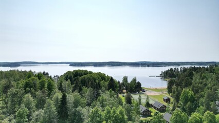 Sticker - Aerial view of a tranquil lake surrounded by residential properties nestled in a sprawling landscape