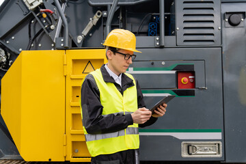 Aufkleber - Engineer with digital tablet next to road construction machine