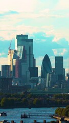 Wall Mural - Panoramic view of the London skyline and famous London skyscrapers. UK, London, The City of London skyline, River Thames. Aerial vertical, vertical video background.