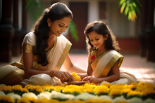 Traditionally Dressed Indian Ethnic Mother And Daughter Making Colourful Arrangement With Flowers In-front Of Their House. Concept For Onam Festival In Kerala