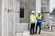 © NVB Stocker - Heavy Industry Engineers teamwork. Two builder and construction worker working together at Prefabricated concrete walls Industry Manufacturing Factory. Unity and teamwork concept
