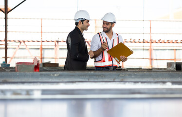 Wall Mural - Heavy Industry Engineers teamwork. builder and construction worker and business owner or manager working together at Prefabricated concrete walls Industry Manufacturing Factory. Unity and teamwork