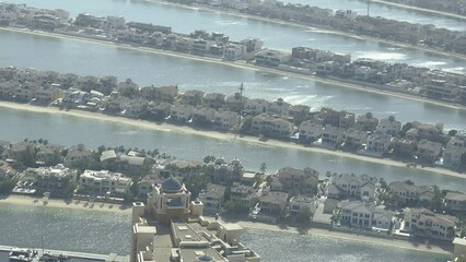 Sticker - Aerial view of lines of houses by the river with misty sky on the horizon