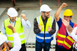 © NVB Stocker - Group of professional Construction engineering people meeting and celebrate at Prefabricated concrete walls Industry Factory. Success teamwork. Ethnic diversity worker people. Unity and teamwork
