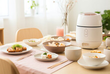 A Minimalist Bright Kitchen With A Rice Cooker And Dishes On Top Of The Dining Table. Generative AI
