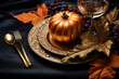 © barmaleeva - Thanksgiving table setting concept. Decorative golden painted leaves and pumpkin. AI generated