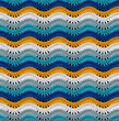 Seamless knitted pattern in the form of openwork waves is crocheted with threads of bright colors. Cotton yarn. Volumetric style.