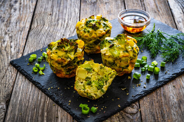 Vegetable savory muffins on wooden background